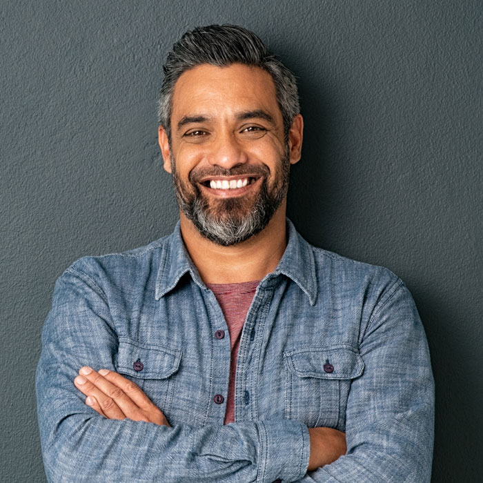 Mid adult man with beard smiling