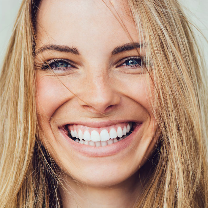 Portrait of young woman with beautiful smile